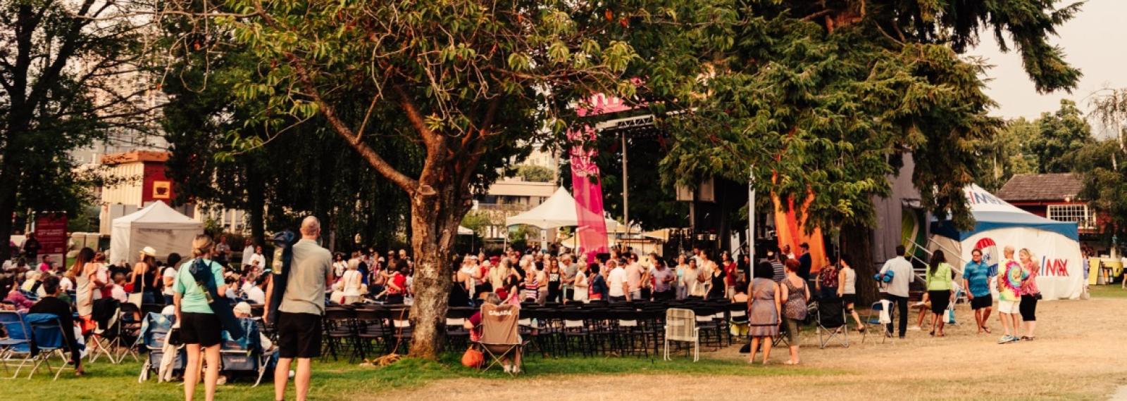 People enjoying an outdoor music festival